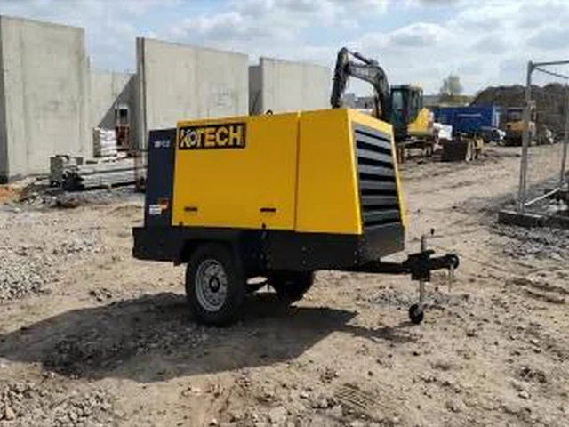 What is intercooling in a two-stage air compressor?